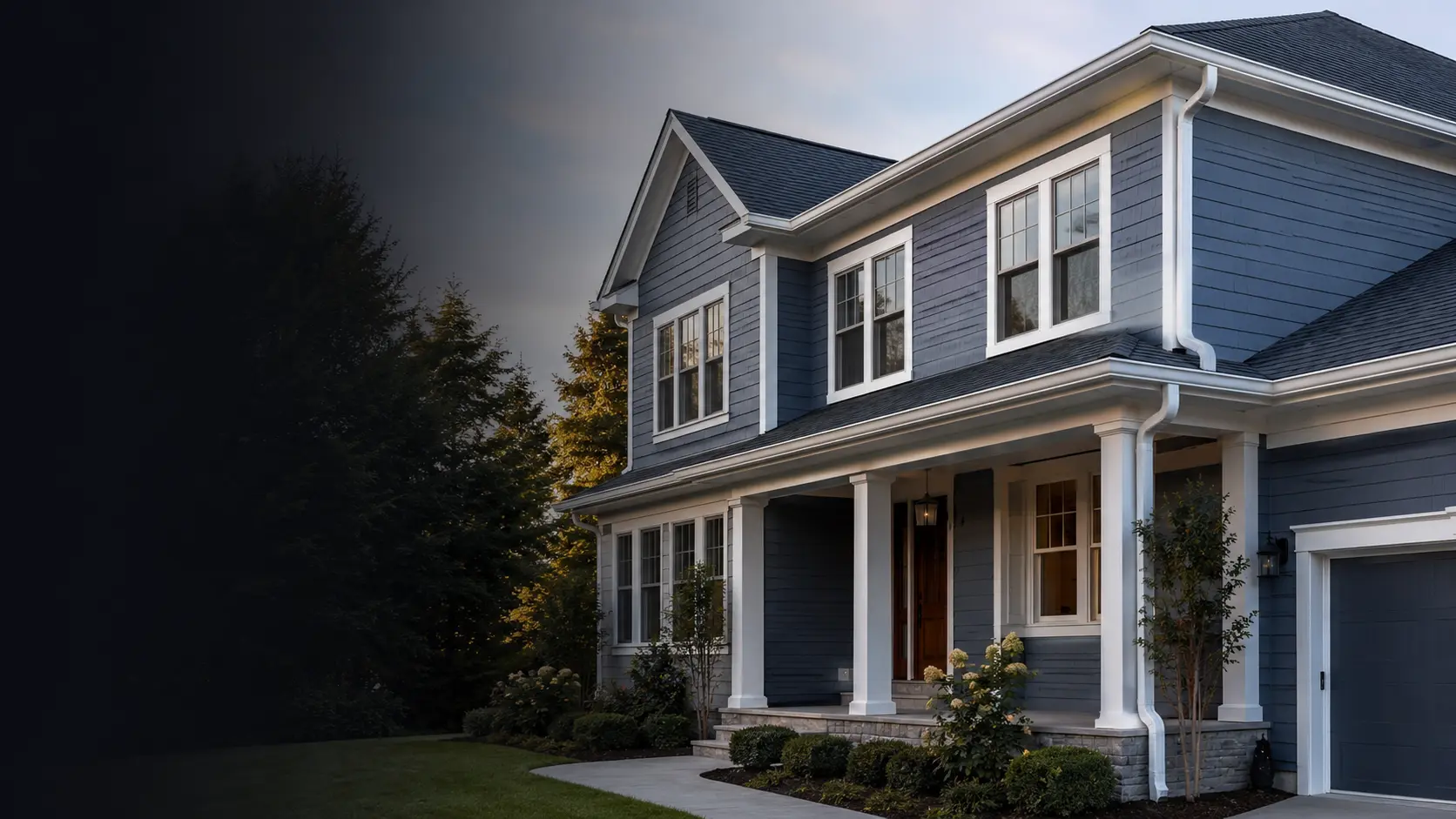 Professional white K-style gutter installation on a two-story home in Durham, North Carolina